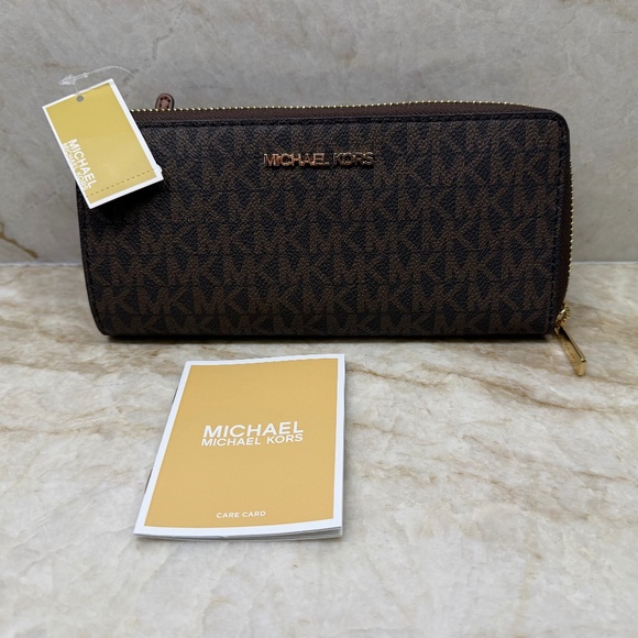 Michael Kors Handbags - Michael Kors Jet Set Travel Large Signature Print Brown Quarter-Zip Wallet